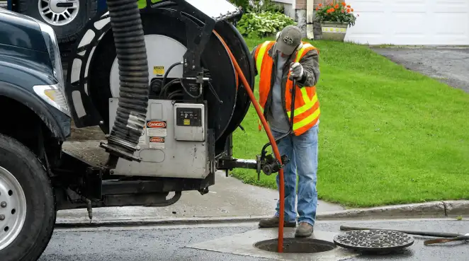 Technician using specialized drainage equipment for sewer line cleaning and foundation protection in ,